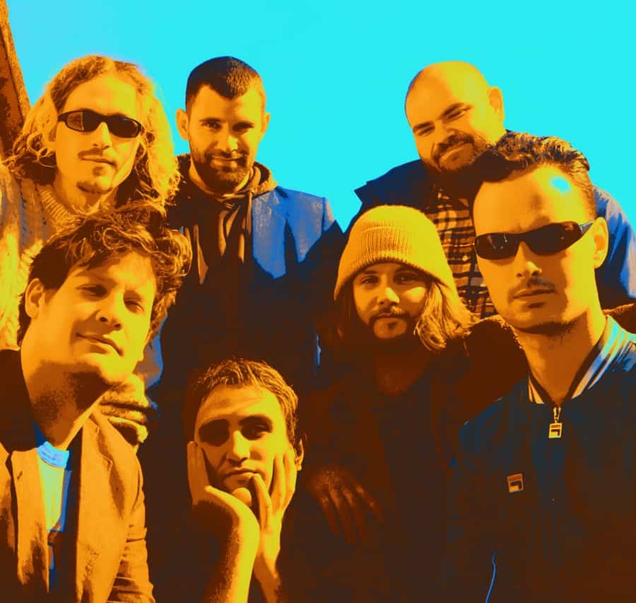 People standing outdoors during daytime, group portrait, diverse young adults, casual attire, sunny weather, vibrant background, modern lifestyle, friendship, social gathering, positive energy, music and news enthusiasts, culture and community, Past Daily sound archive imagery.