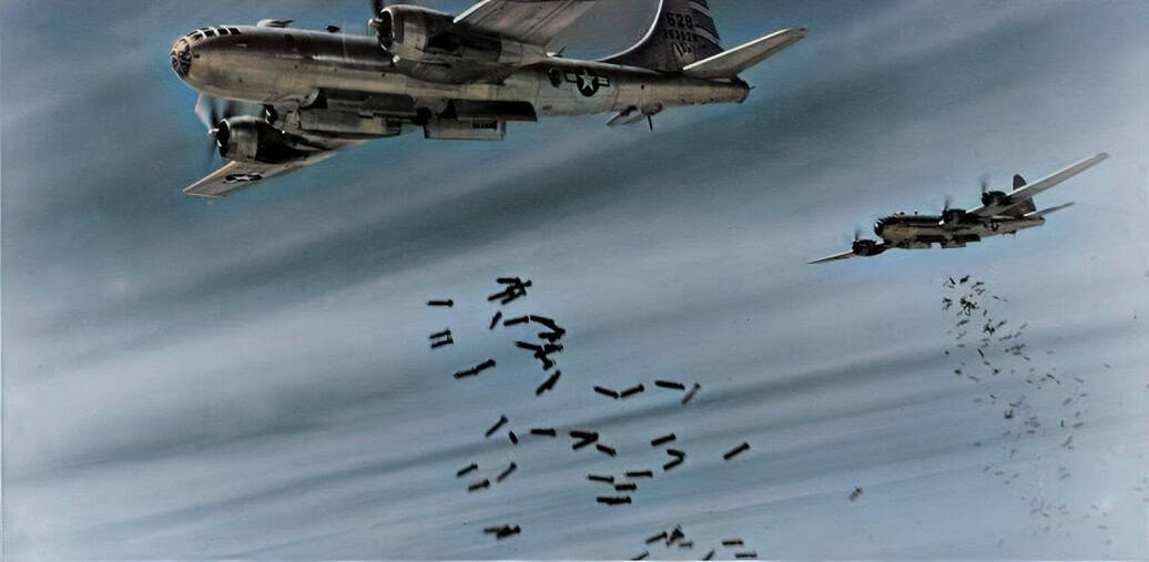 F-4 Phantom II fighter jets dropping bombs during a military mission.