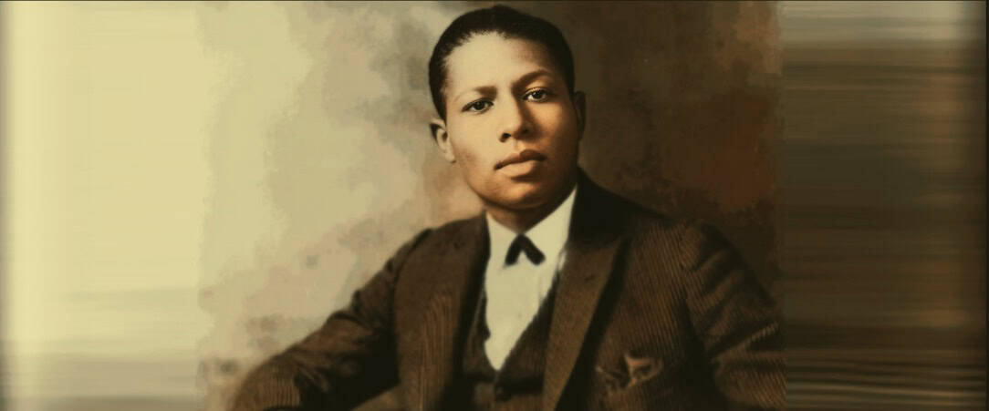 Renowned African American musician and activist, captured in a historic black-and-white photo, emphasizing cultural heritage and musical legacy.