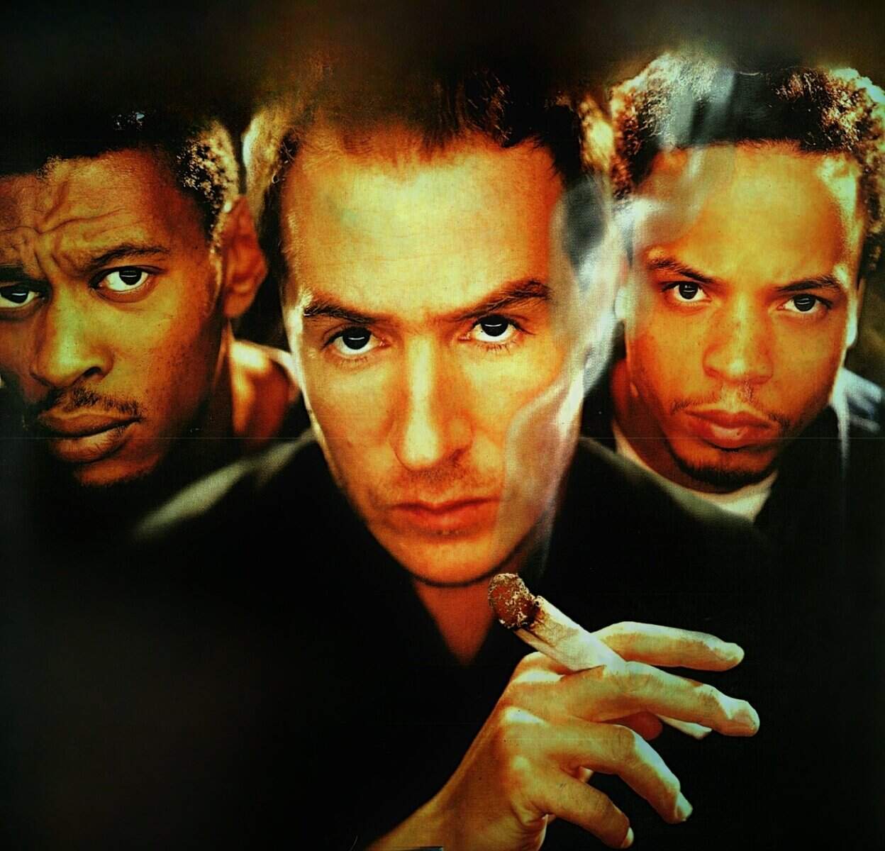 Blurred close-up image of three men with intense expressions, featuring a central figure holding a cigar, showcasing themes of music, history, and cultural influence, perfect for a sound archive website.