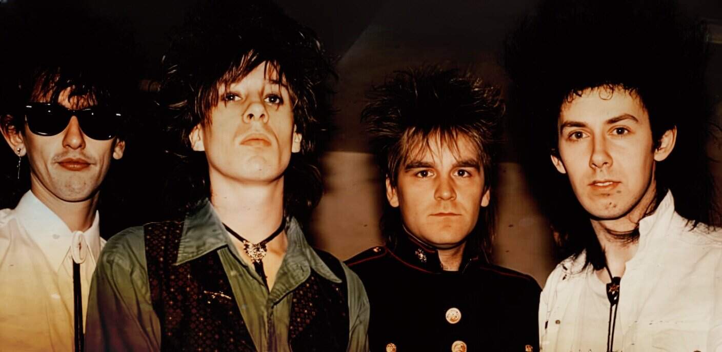 Vintage rock band portrait featuring stylish musicians with iconic 1980s hairstyles, emphasizing music history and classic rock music visuals.