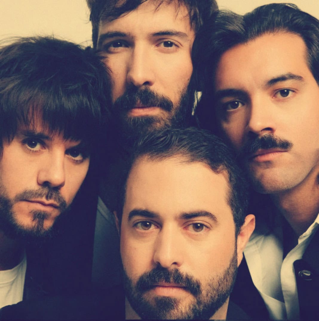 Close-up of The Beatles, iconic British rock band, featuring Paul McCartney, John Lennon, George Harrison, and Ringo Starr, highlighting their influence on music history and culture.