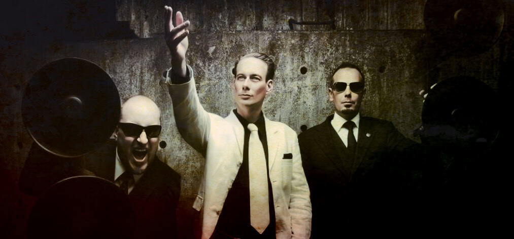 Past daily music archive, band members in suits with vintage style, classic black-and-white photography for news, history, and music preservation, historical sound recording collection, vintage music history, archival audio media.