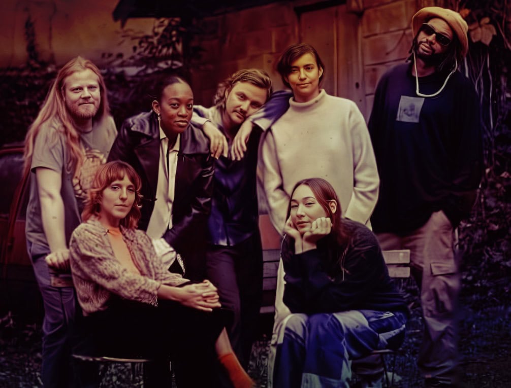 Young diverse group of friends outdoors in casual clothing, socializing and having fun, representing community, friendship, and youth culture, suitable for music, history, and news archives image SEO.