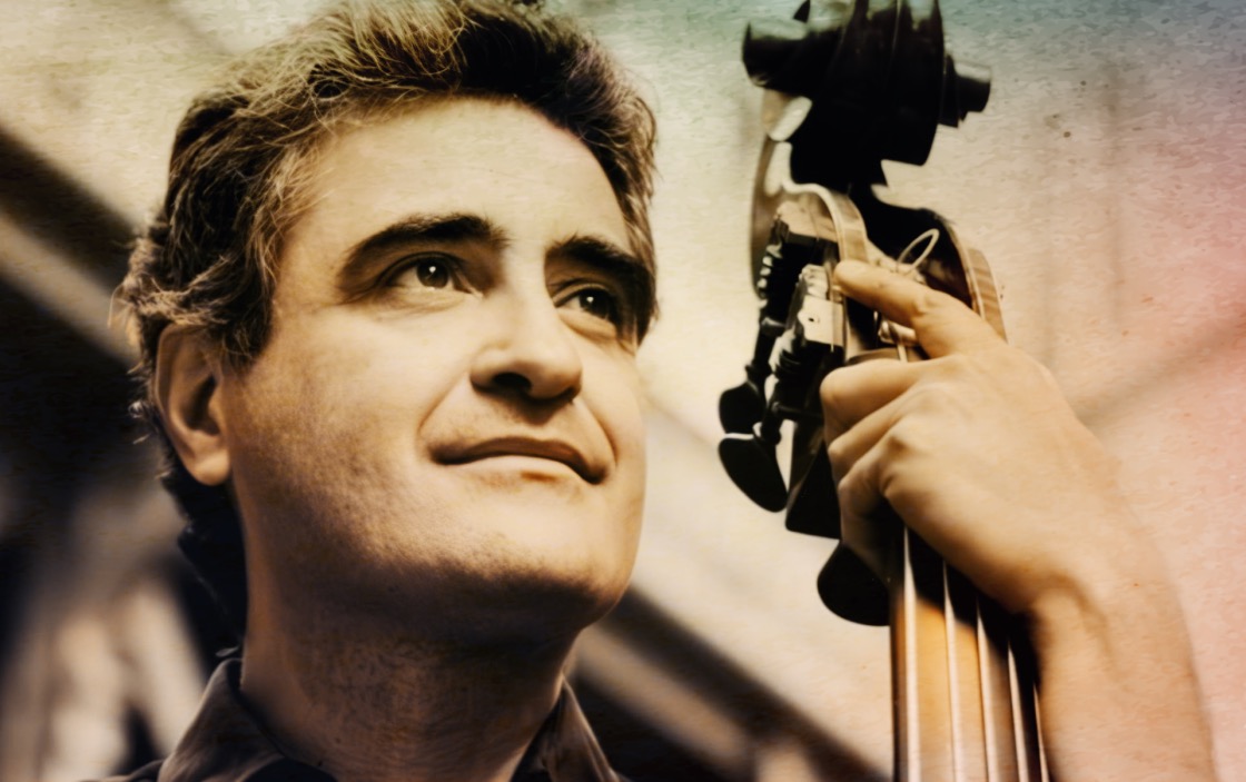 Vintage musician holding a guitar, celebrating music history and news archive, symbolizing past daily sound recordings.