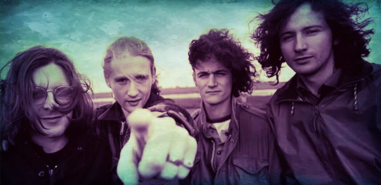 Past daily sound archive of music and history featuring 90s rock band members outdoors.