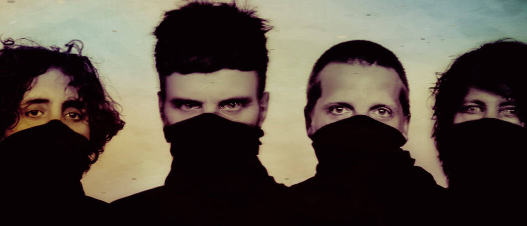 Fourth-wave black-clad protesters with masked faces and intense gazes, showcasing unity and resilience in a social movement.