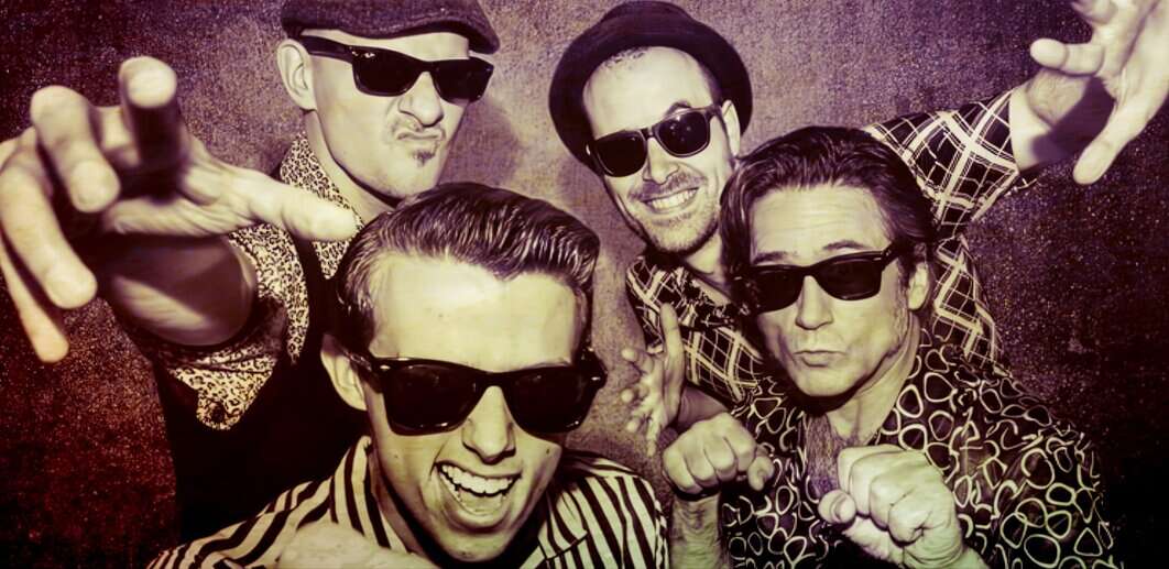 Vibrant vintage-style photo of five men wearing sunglasses and fashionable patterned shirts, expressing energetic poses and enthusiasm, representing music and entertainment culture.