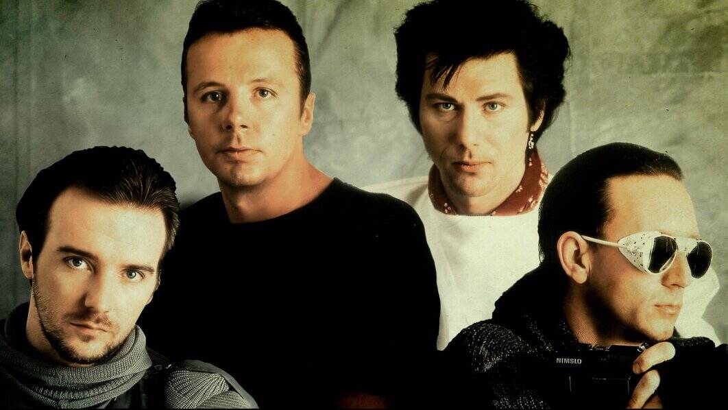 Rhcp band members, red hot chili peppers, energetic rock musicians, iconic band portrait, legendary rock band promotional photo.